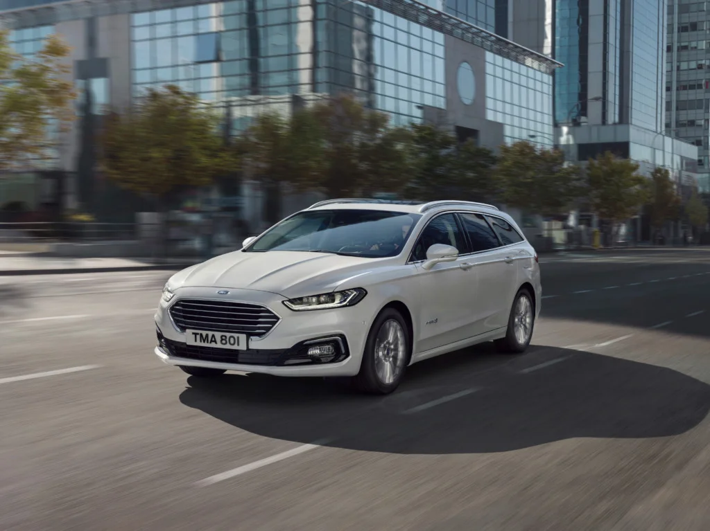 The Ford Mondeo in white.
