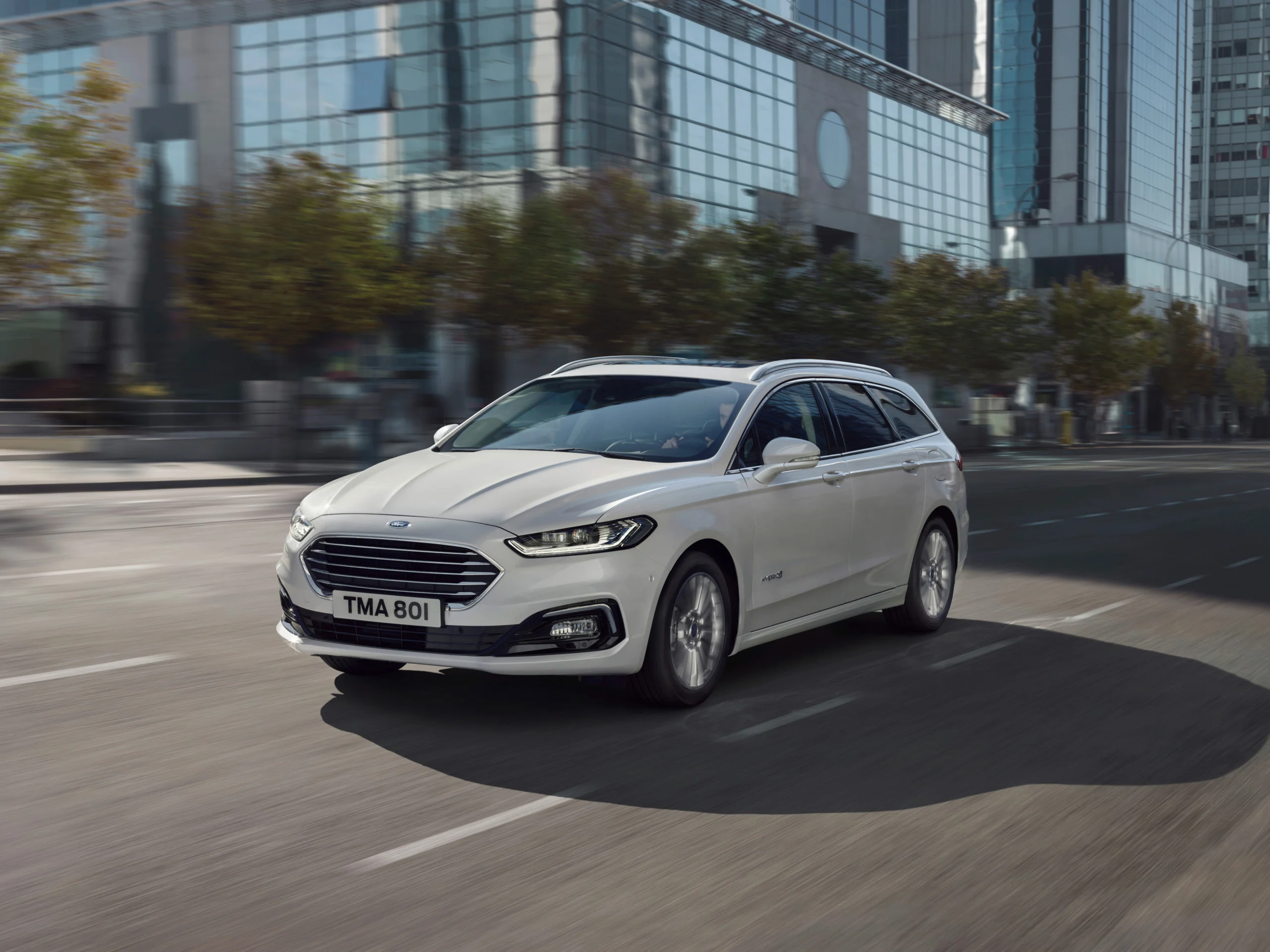 The Ford Mondeo in white.