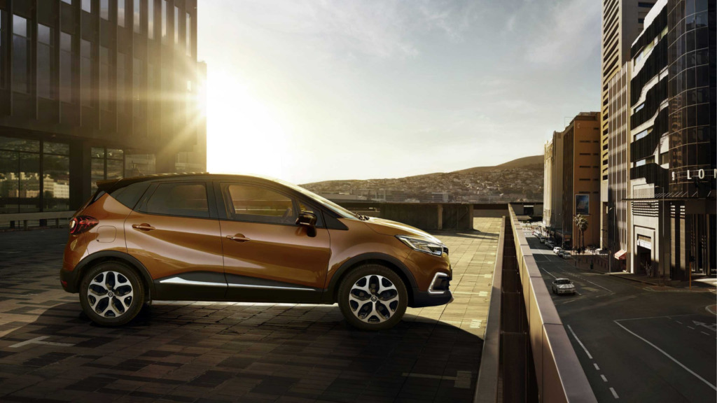 The sun setting over a Renault Captur